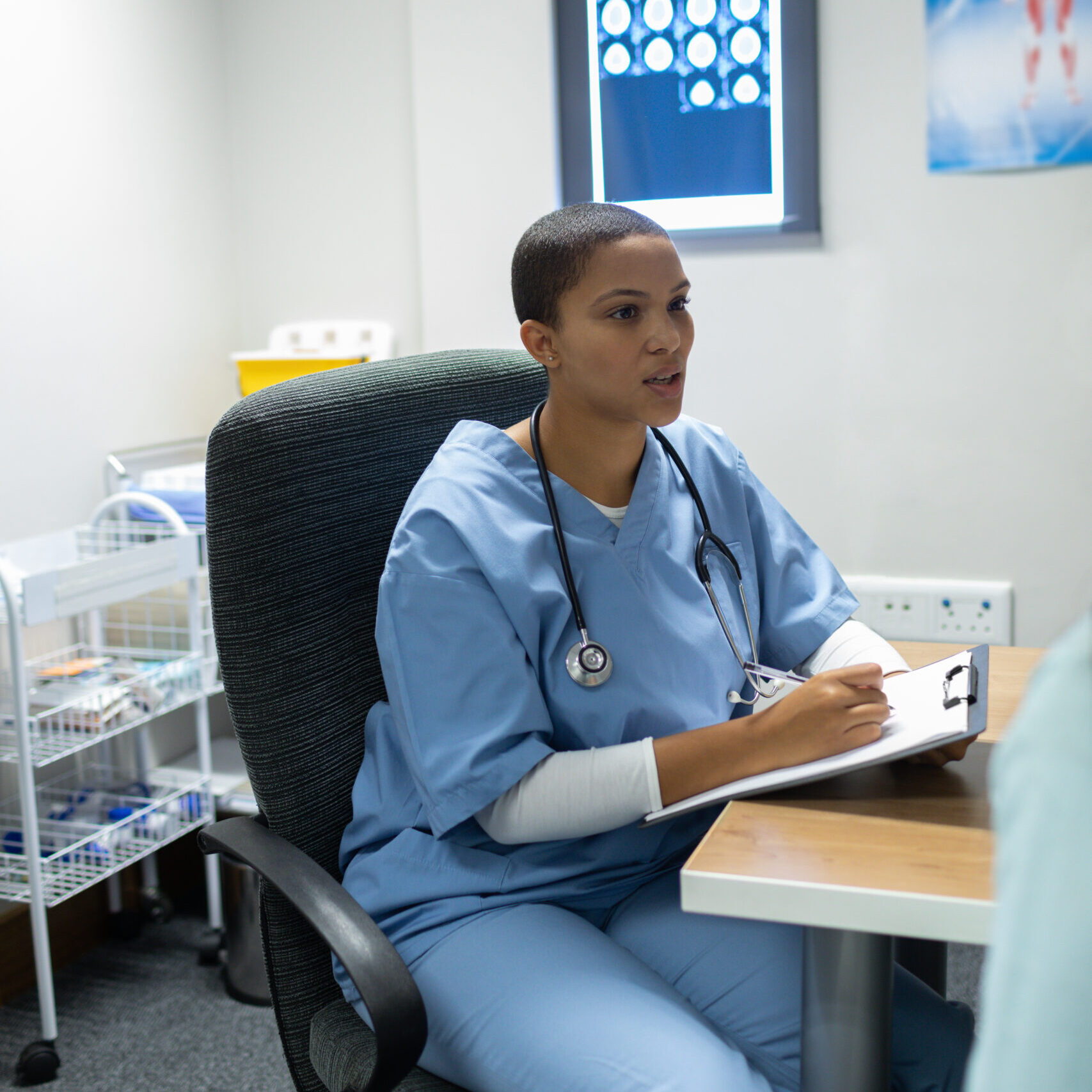 A clinician conducting a case review of a patient